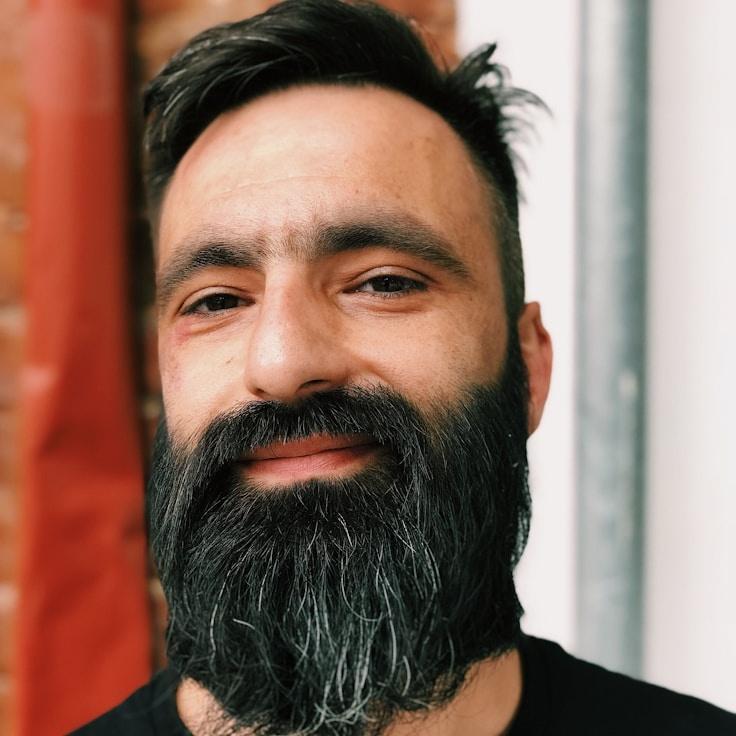 Portrait of Ash, group coordinator and fusion cooking expert